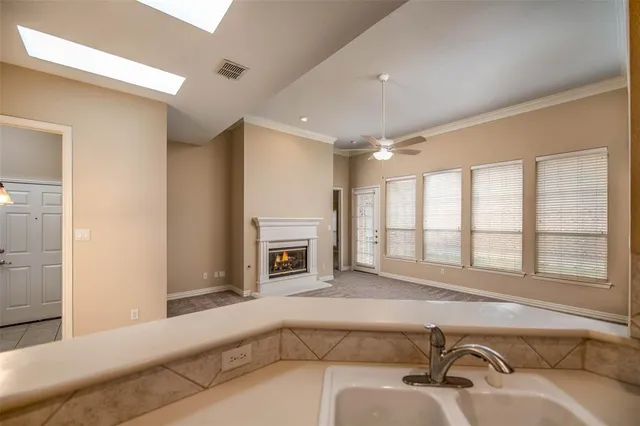 a living room with furniture and fireplace