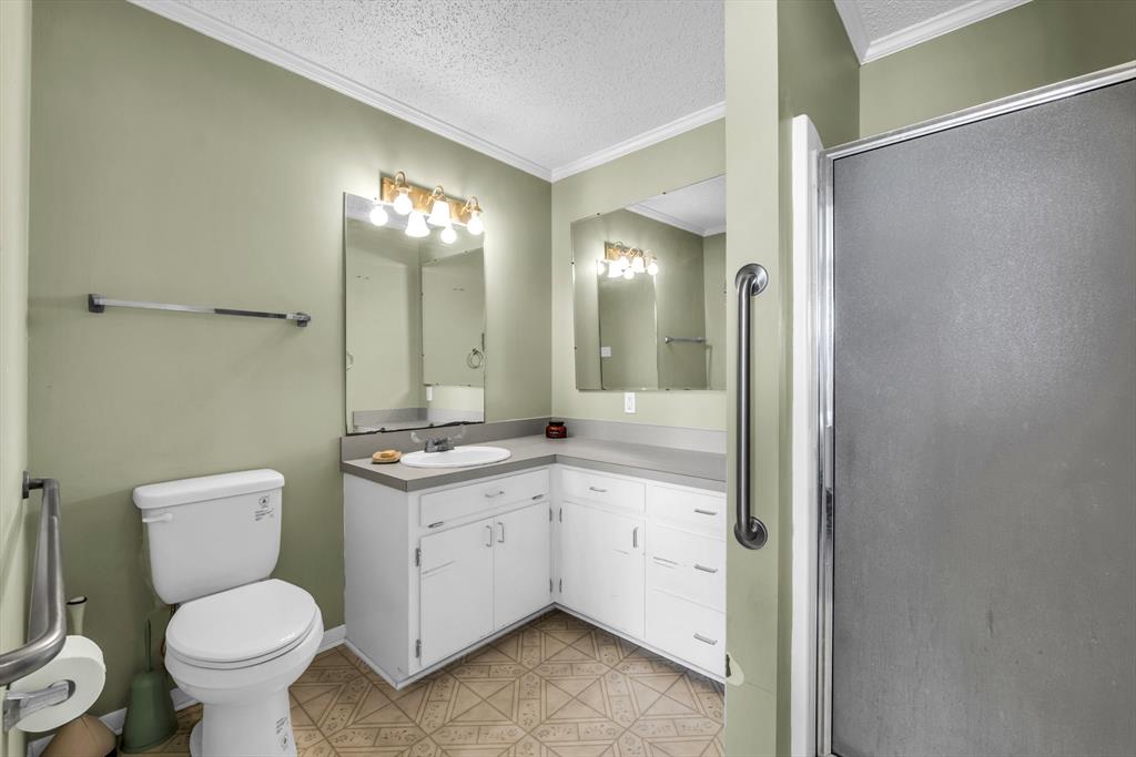 982 North Houston Street Lorena, TX 76655 - Photo 12 of 35 a bathroom with a toilet sink and mirror