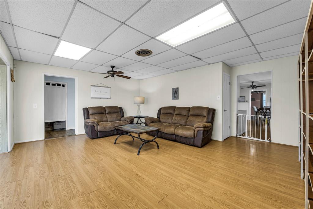 982 North Houston Street Lorena, TX 76655 - Photo 15 of 35 a living room with furniture and a wooden floor