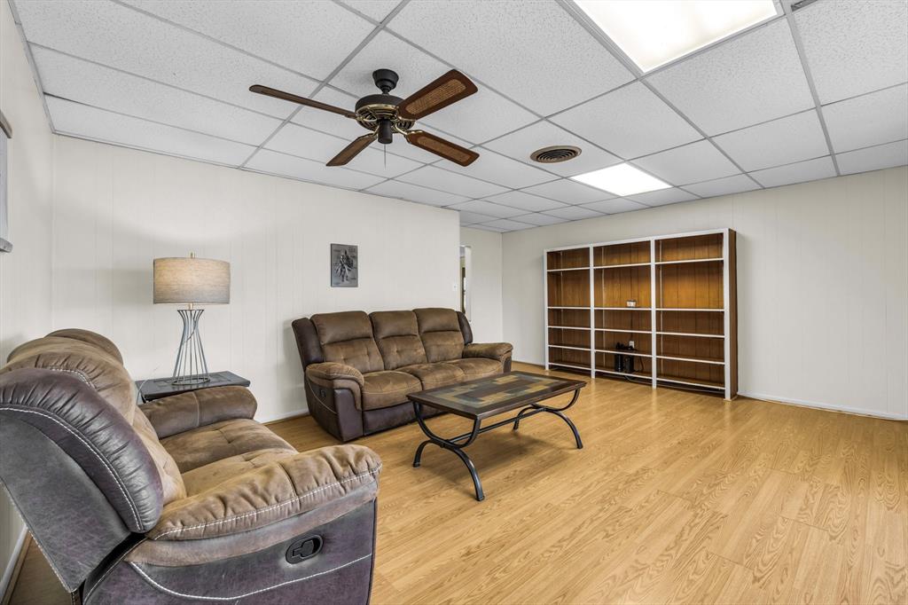 982 North Houston Street Lorena, TX 76655 - Photo 16 of 35 a living room with furniture and a wooden floor