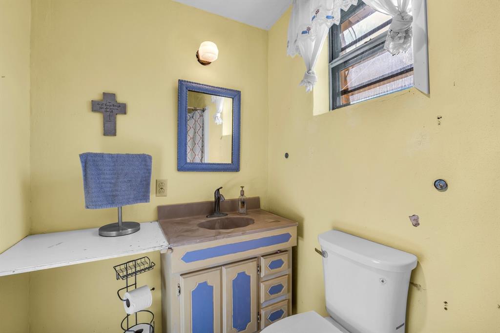 982 North Houston Street Lorena, TX 76655 - Photo 18 of 35 a bathroom with a sink a toilet and mirror