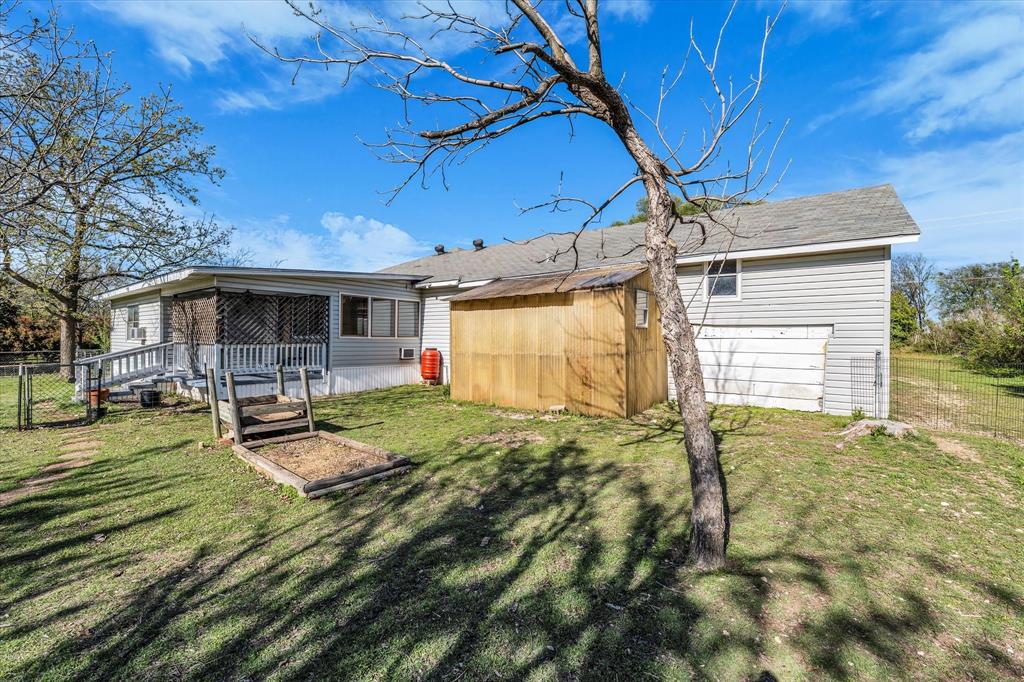 982 North Houston Street Lorena, TX 76655 - Photo 23 of 35 a backyard of a house with yard and outdoor seating