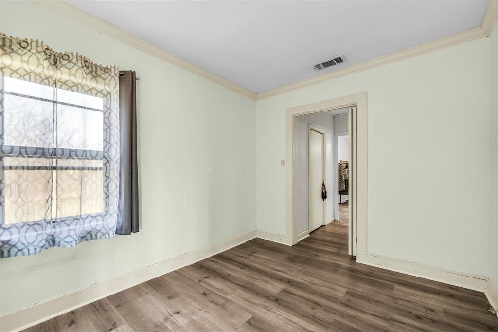 982 North Houston Street Lorena, TX 76655 - Photo 9 of 35 a view of an empty room with wooden floor and a window