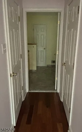 an empty room with wooden floor