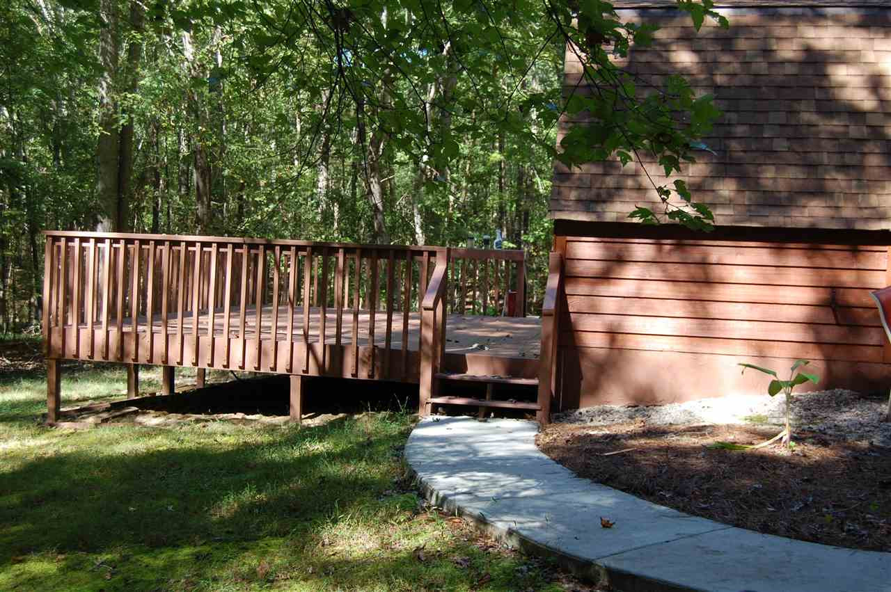 1121 Batchelor Road Apex, NC 27523 - Photo 29 of 30 Concrete patio goes from front patio around to back deck! Patio/Deck