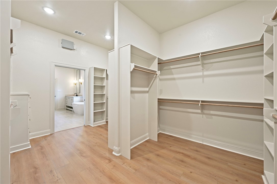 7052 Skipping Rock Path Bryan, TX 77808 - Photo 14 of 23 a view of an empty walk in closet