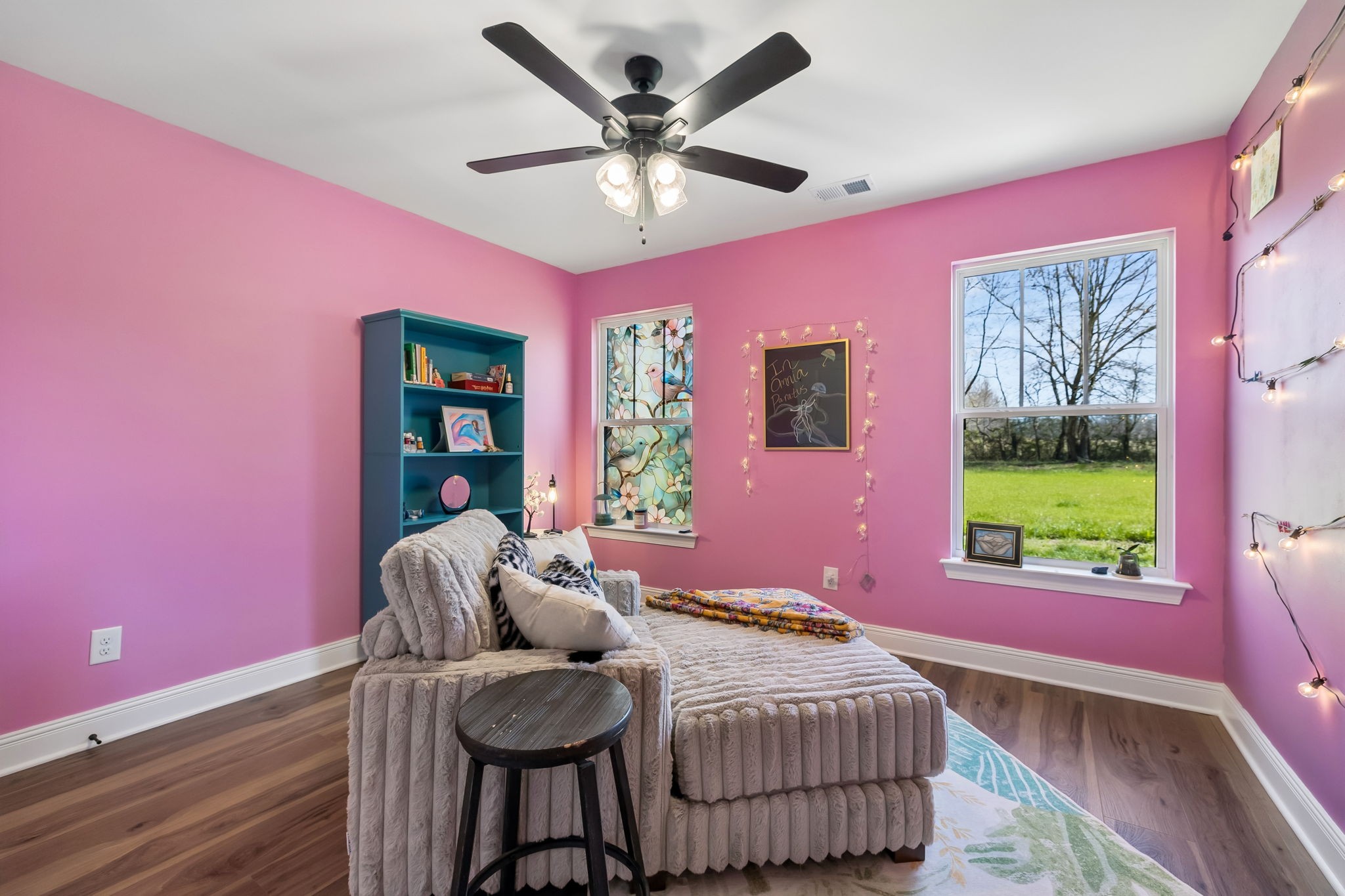 3165 Lights Chapel Road Greenbrier, TN 37073 - Photo 14 of 17 a bedroom with a bed and dresser with wooden floor