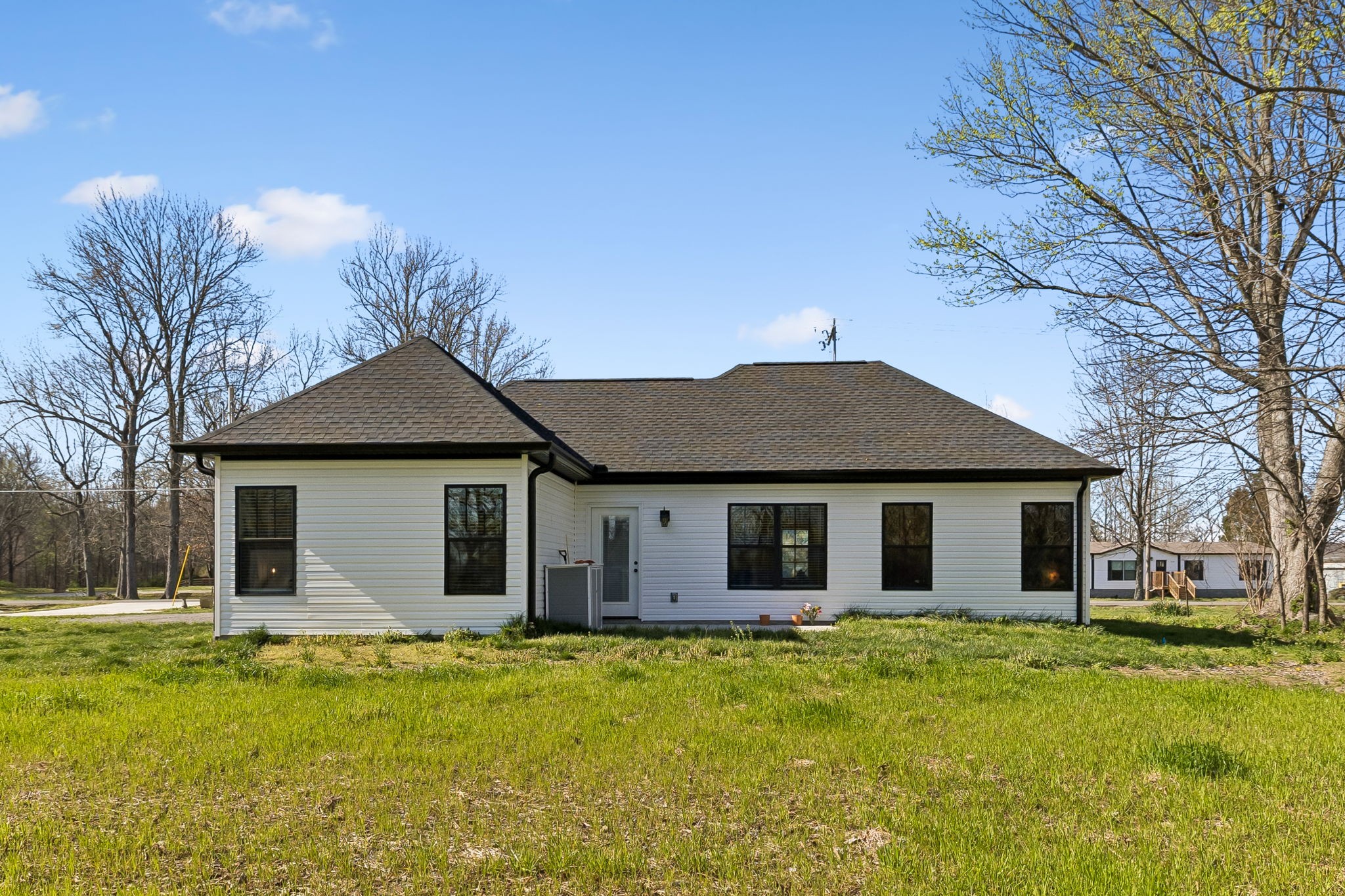 3165 Lights Chapel Road Greenbrier, TN 37073 - Photo 16 of 17 a front view of a house with a yard