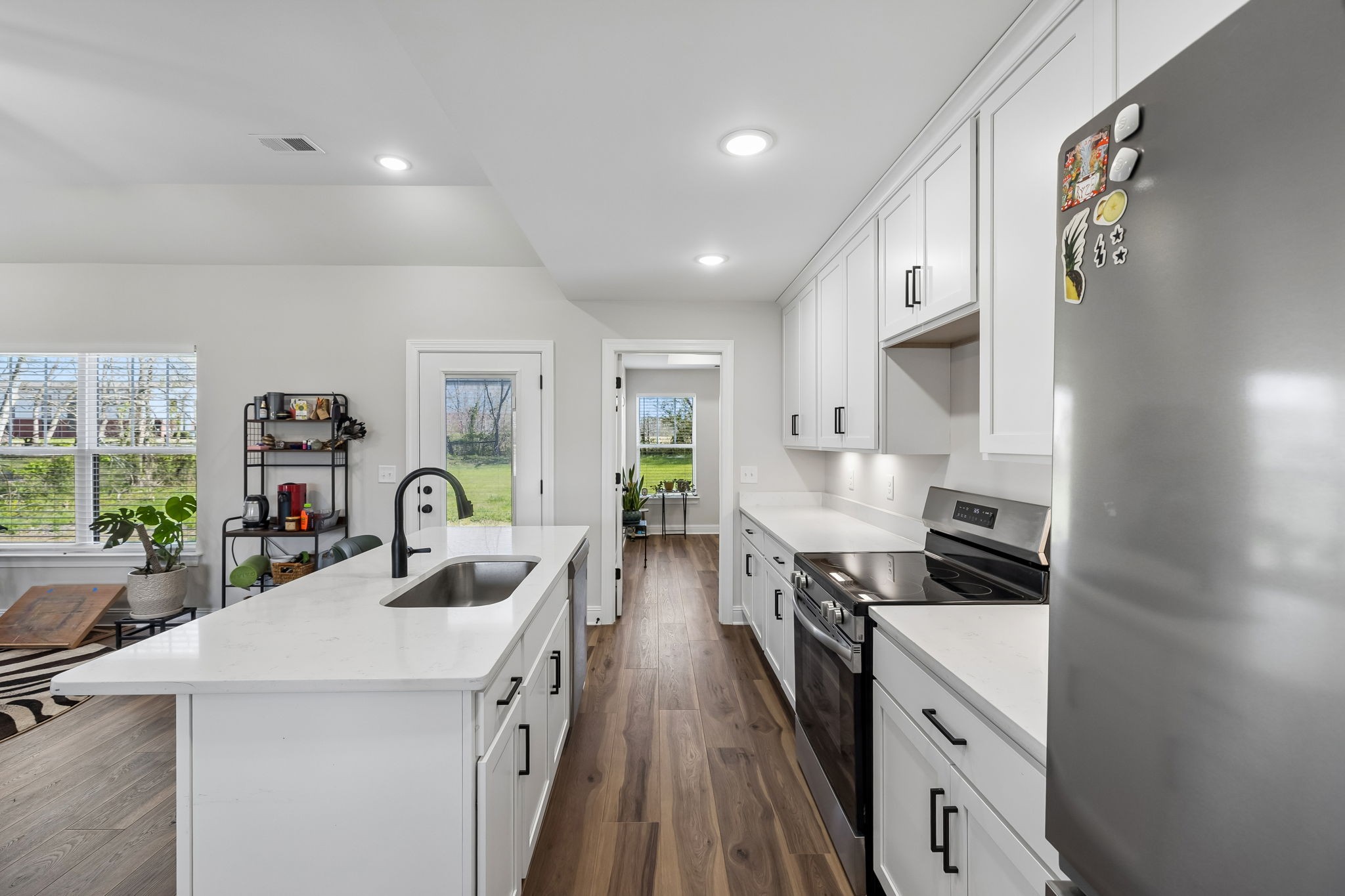 3165 Lights Chapel Road Greenbrier, TN 37073 - Photo 7 of 17 a kitchen with a sink stove and cabinets