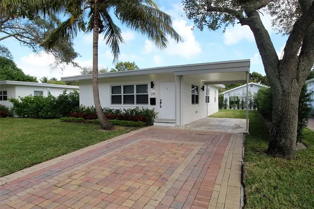 front view of a house with a garden
