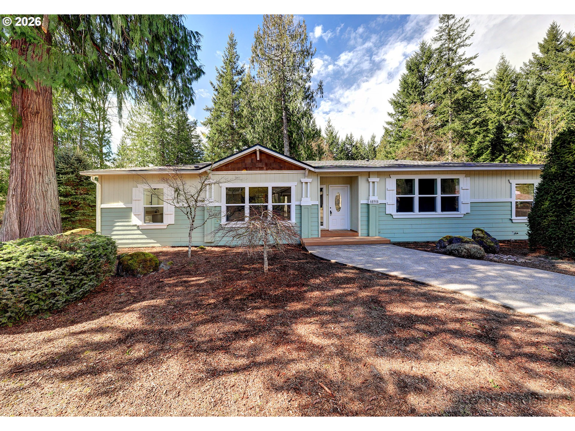 68908 East Cedar Hill Loop Welches, OR 97067 - Photo 1 of 21 a view of a house with a yard