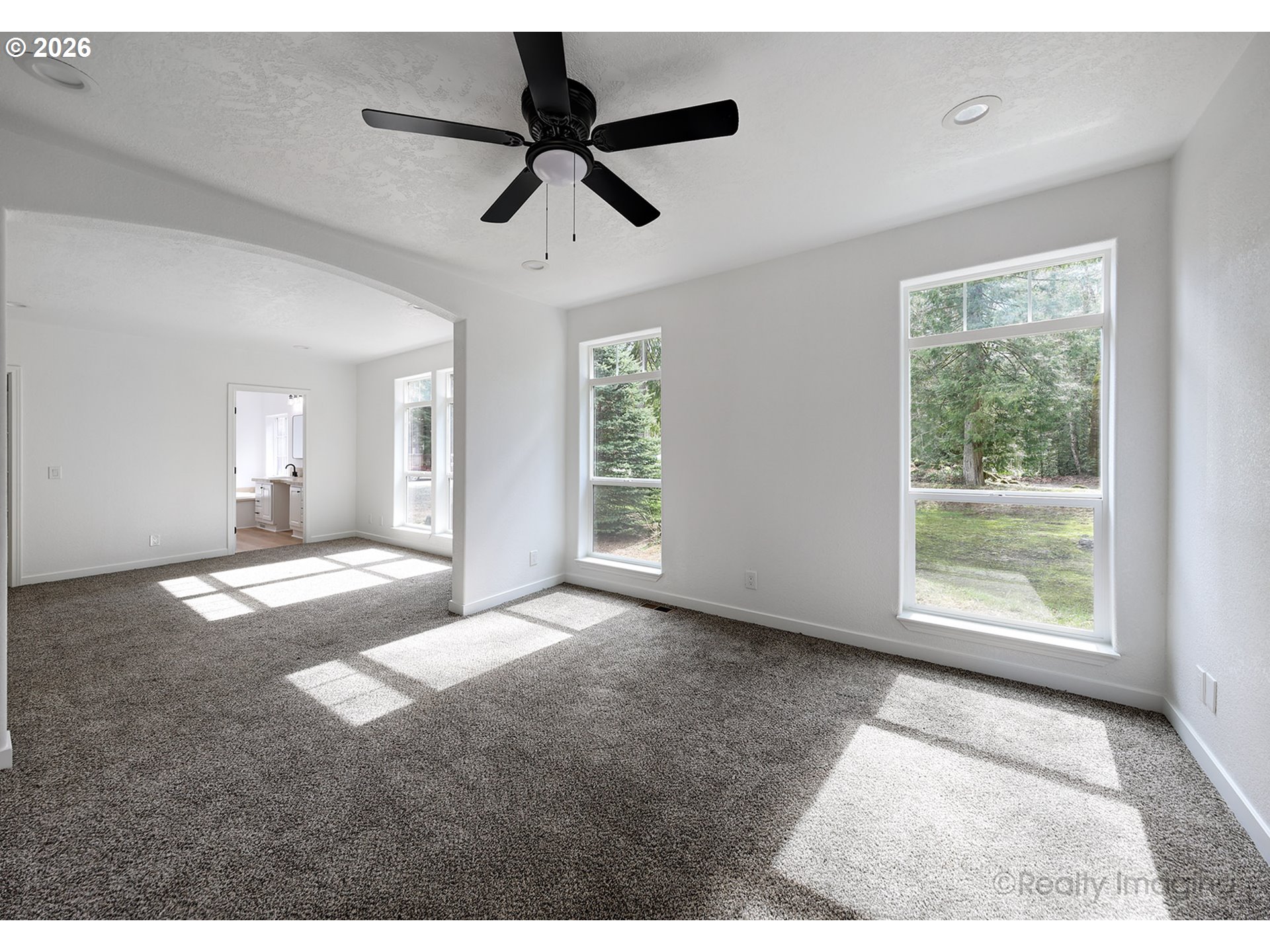 68908 East Cedar Hill Loop Welches, OR 97067 - Photo 12 of 21 a view of a livingroom with a ceiling fan and window