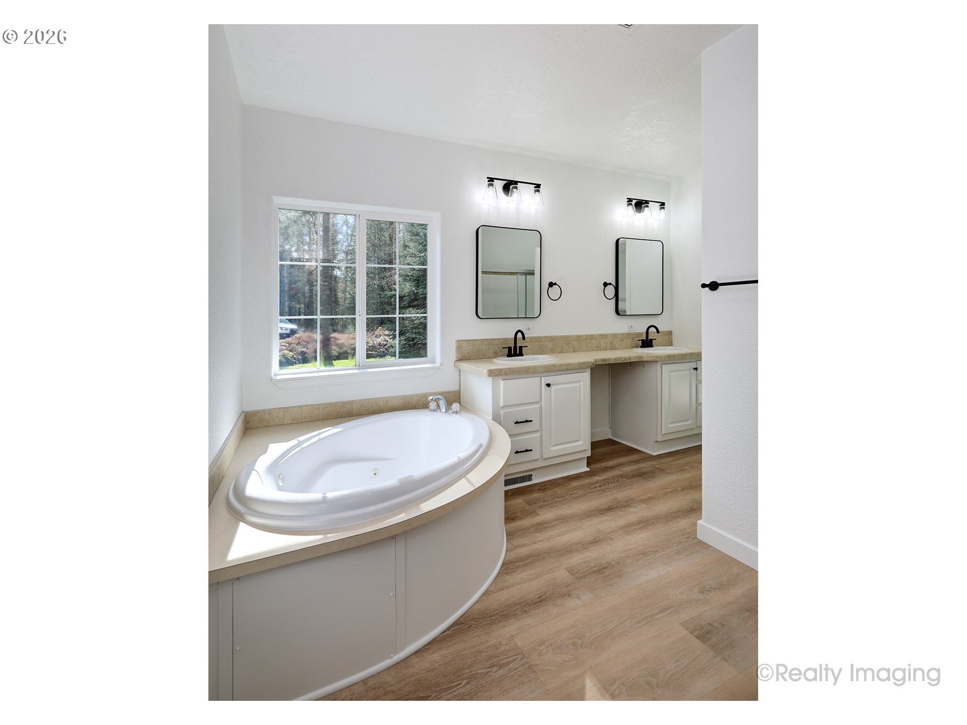 68908 East Cedar Hill Loop Welches, OR 97067 - Photo 14 of 21 a spacious bathroom with a sink toilet a mirror and bathtub