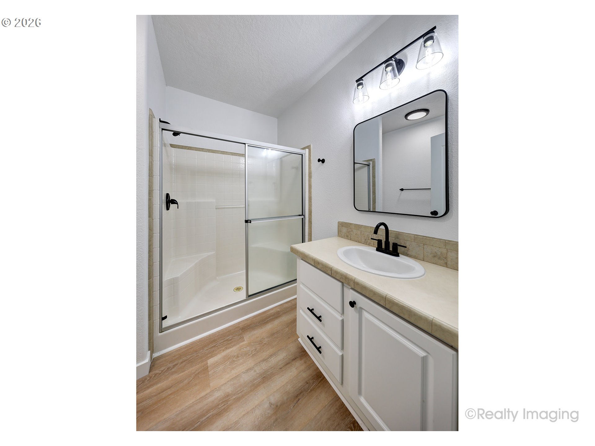 68908 East Cedar Hill Loop Welches, OR 97067 - Photo 16 of 21 a bathroom with a double vanity sink mirror and shower