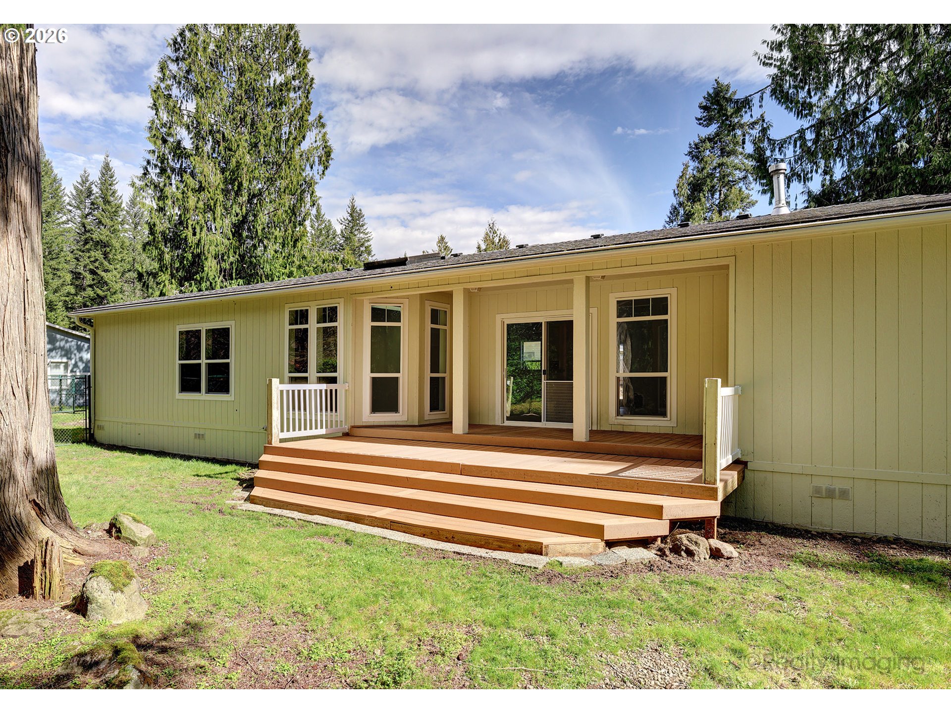 68908 East Cedar Hill Loop Welches, OR 97067 - Photo 20 of 21 a backyard of a house with seating space
