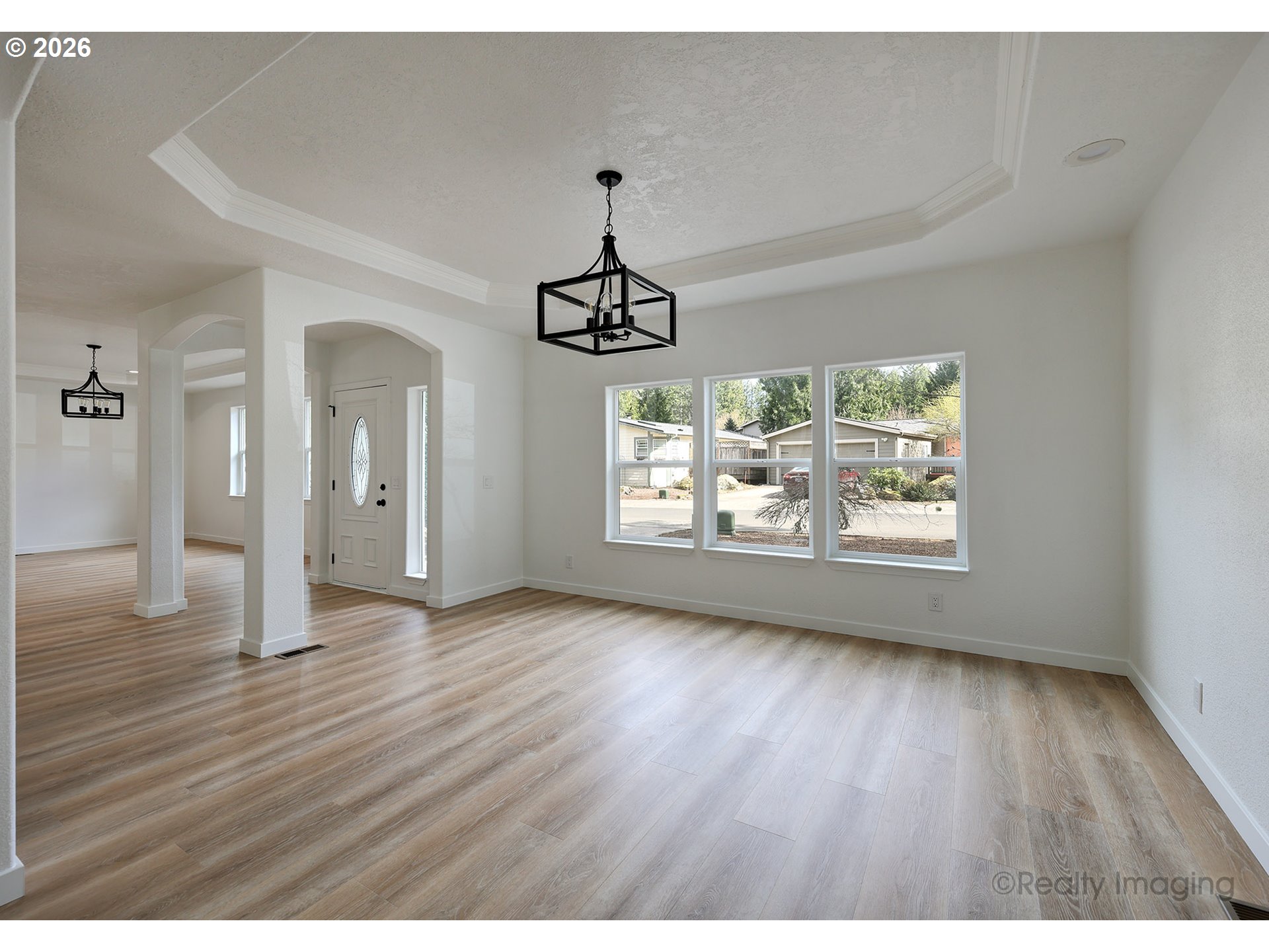 68908 East Cedar Hill Loop Welches, OR 97067 - Photo 4 of 21 a view of an empty room with wooden floor and a window