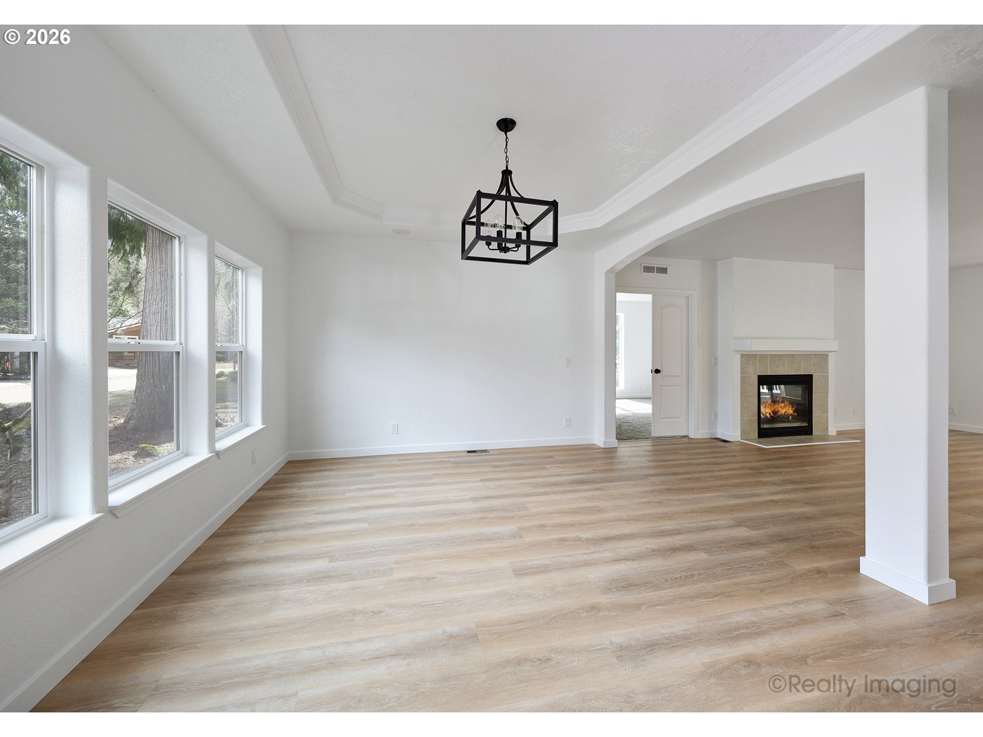 68908 East Cedar Hill Loop Welches, OR 97067 - Photo 5 of 21 a view of an empty room with window and wooden floor