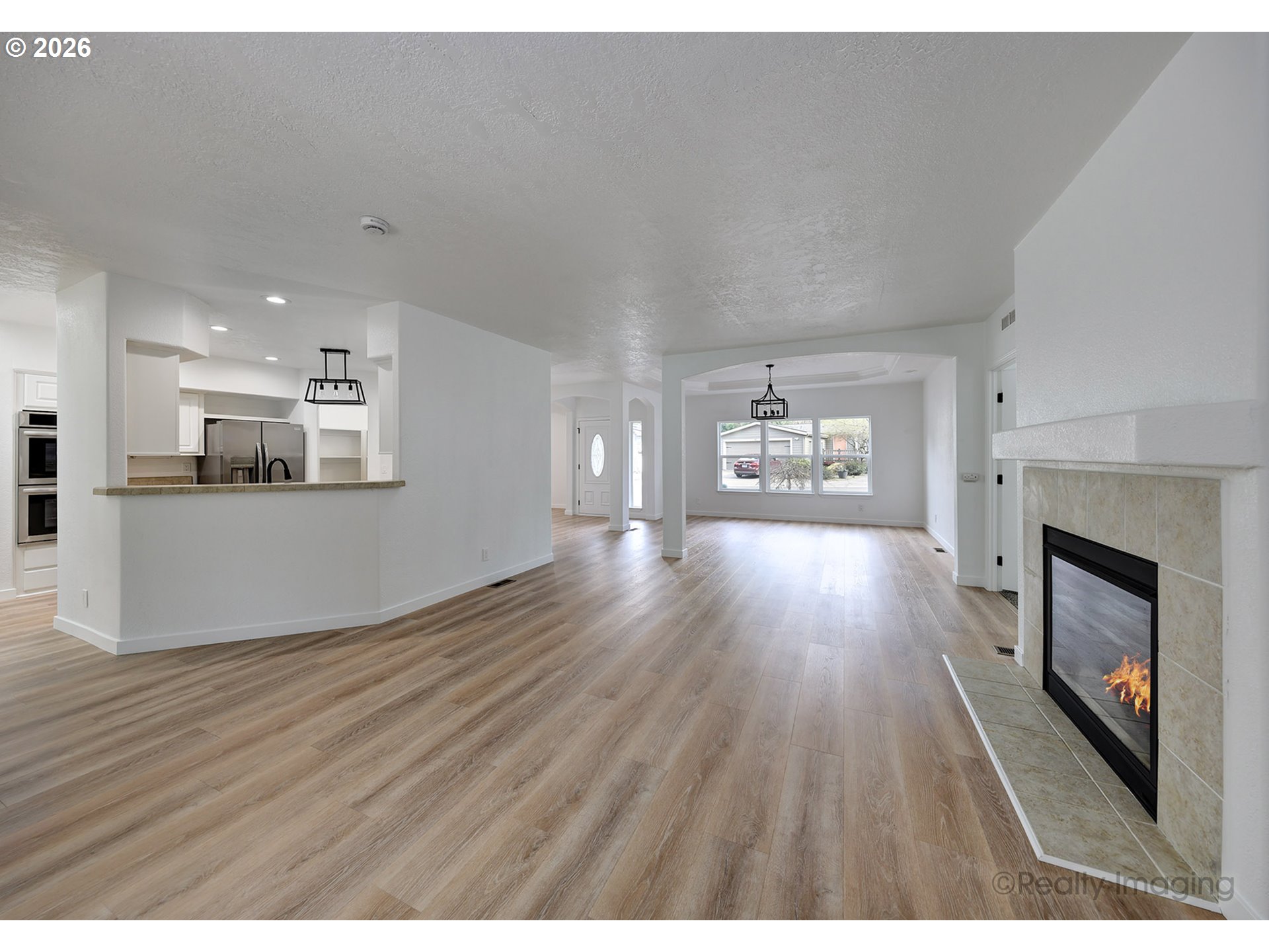 68908 East Cedar Hill Loop Welches, OR 97067 - Photo 7 of 21 a living room with stainless steel appliances kitchen island wooden floors and view living room