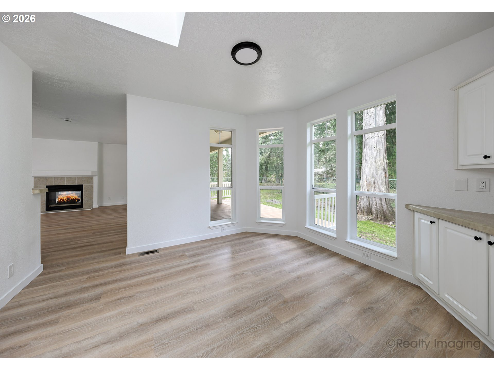 68908 East Cedar Hill Loop Welches, OR 97067 - Photo 10 of 21 a view of an empty room with wooden floor and a window