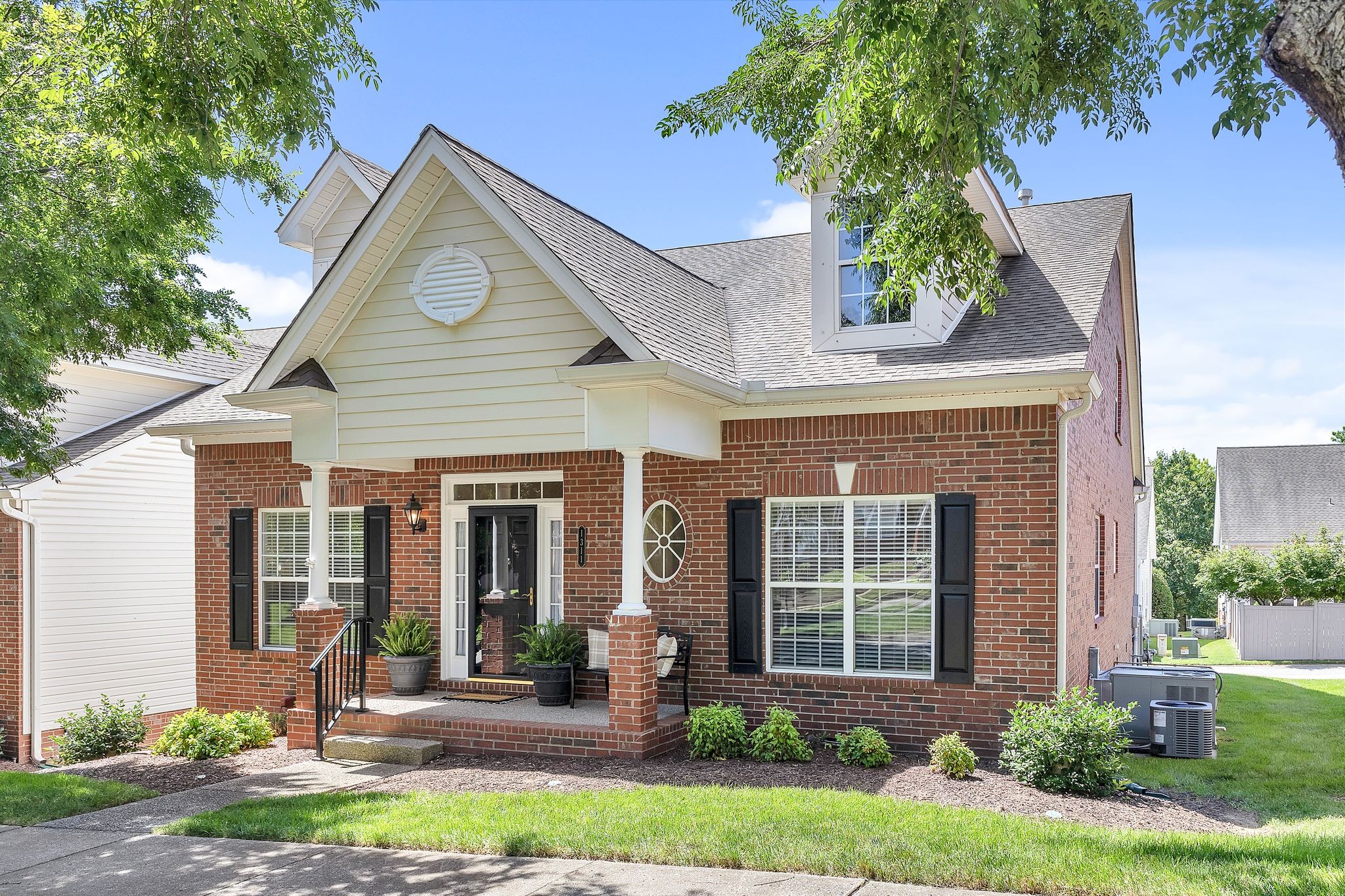 1311 Decatur Circle Franklin, TN 37067 - Photo 3 of 38 front view of a house with a yard and an trees