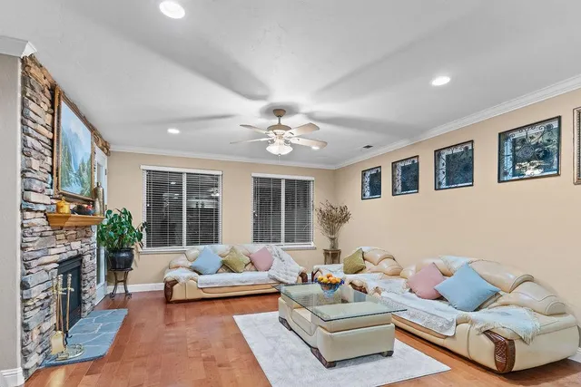 a kitchen with granite countertop stainless steel appliances and wooden cabinets