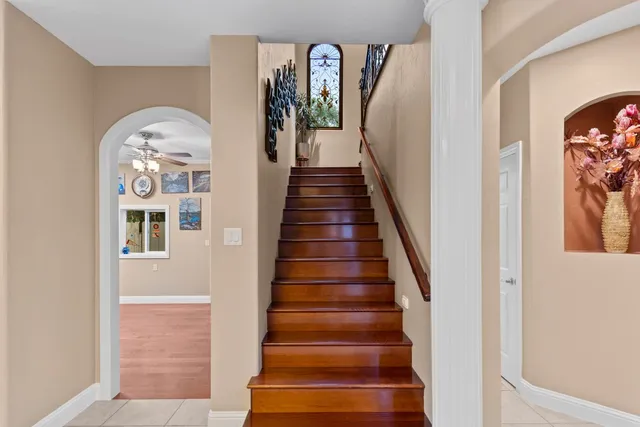 a view of a livingroom with furniture wooden floor and chandelier