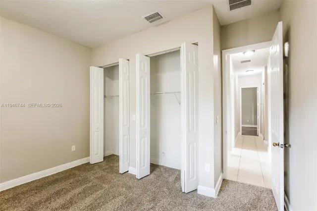 a white bath tub sitting next to a white toilet