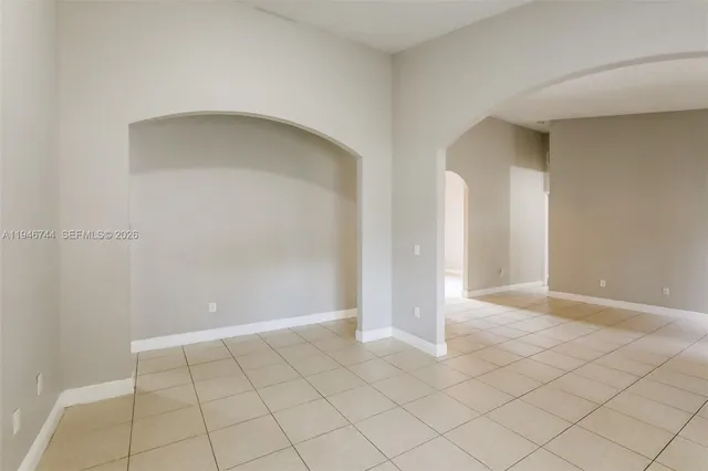 a view of an empty room and window