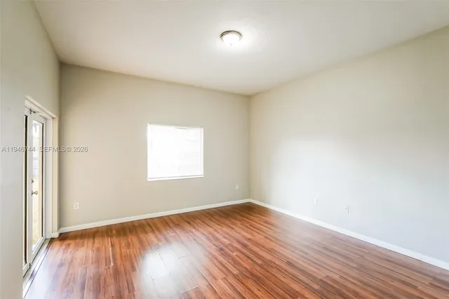 a bedroom with a bed and a potted plant