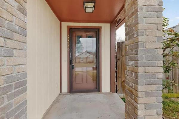 a view of entryway with a brick wall