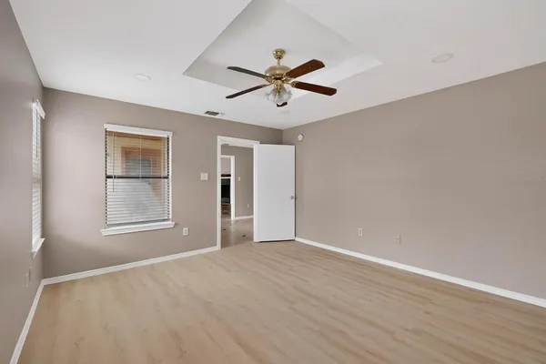 a view of an empty room with a window