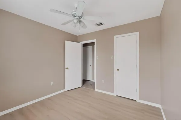 a view of an empty room with a bathroom