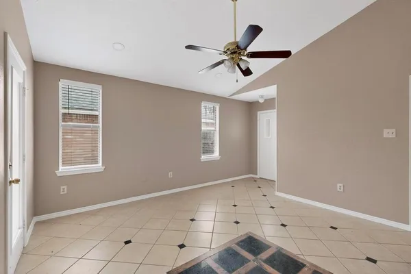 a view of an empty room with a window