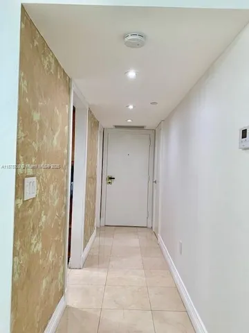 a bathroom with a sink a toilet a mirror and bathtub