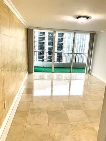 a kitchen with stainless steel appliances kitchen island granite countertop a sink and a stove