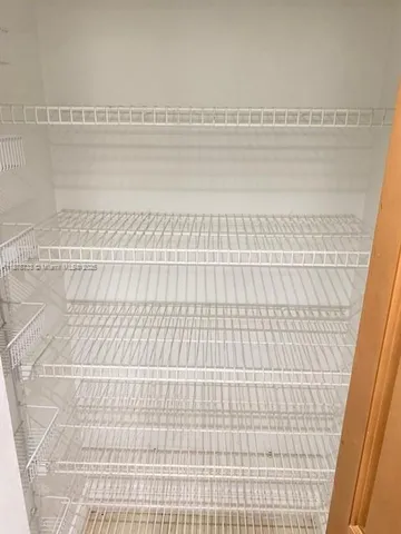 a bathroom with a toilet a sink and a mirror