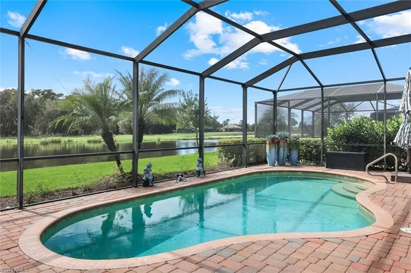 a view of a backyard with a swimming pool