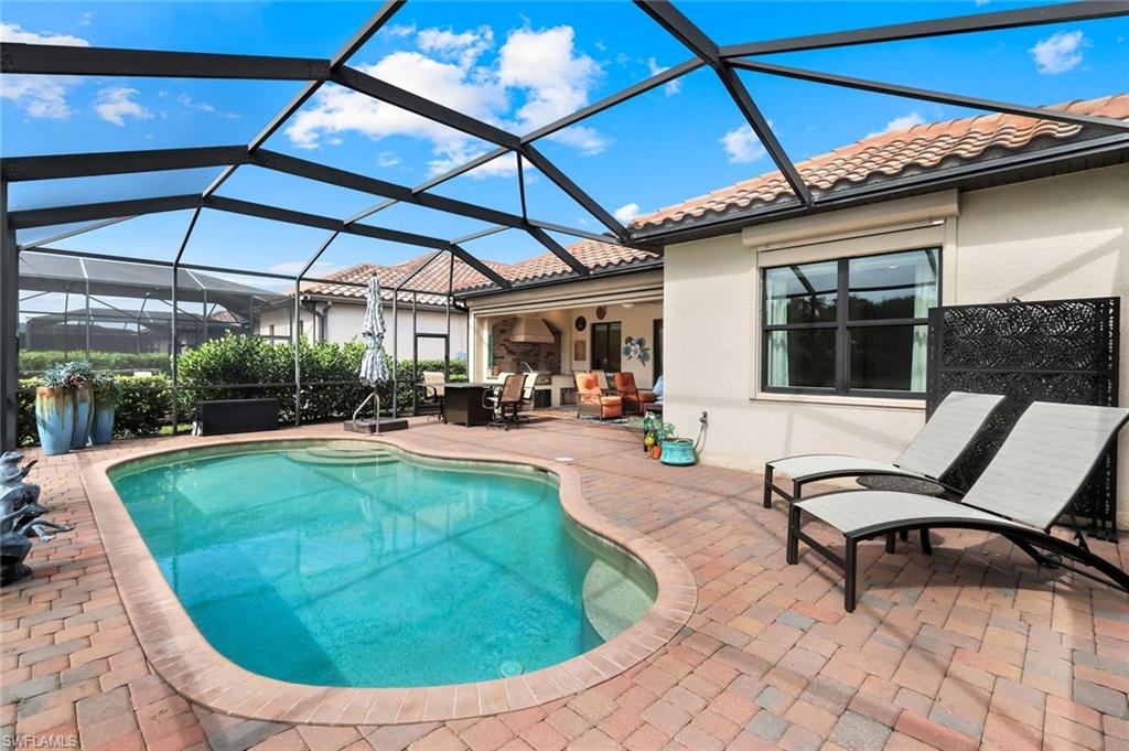 12832 Kinross Lane Naples, FL 34120 - Photo 22 of 44 a view of a backyard with sitting area