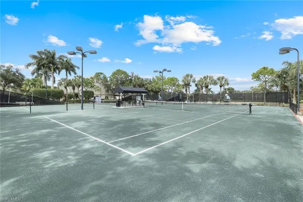 a view of a playground with basketball court
