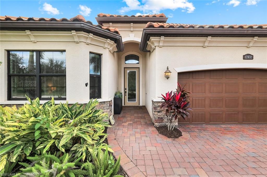 12832 Kinross Lane Naples, FL 34120 - Photo 44 of 44 a view of a house with a flower garden
