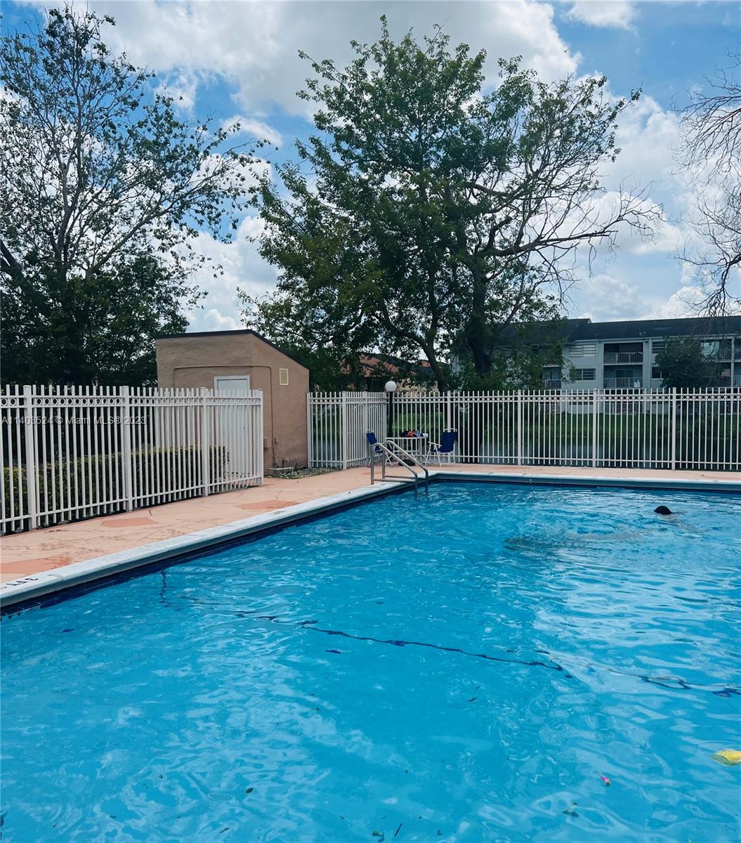 8400 Southwest 154th Cir Court, Unit 716 Miami, FL 33193 - Photo 3 of 6 a view of a garden