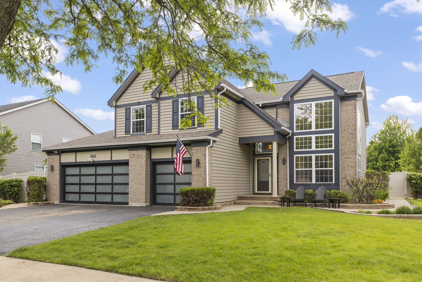 front view of a house with a yard
