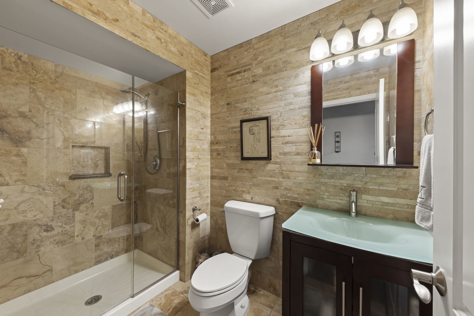 1462 Haversham Drive Aurora, IL 60502 - Photo 13 of 44 a bathroom with a toilet a sink and shower