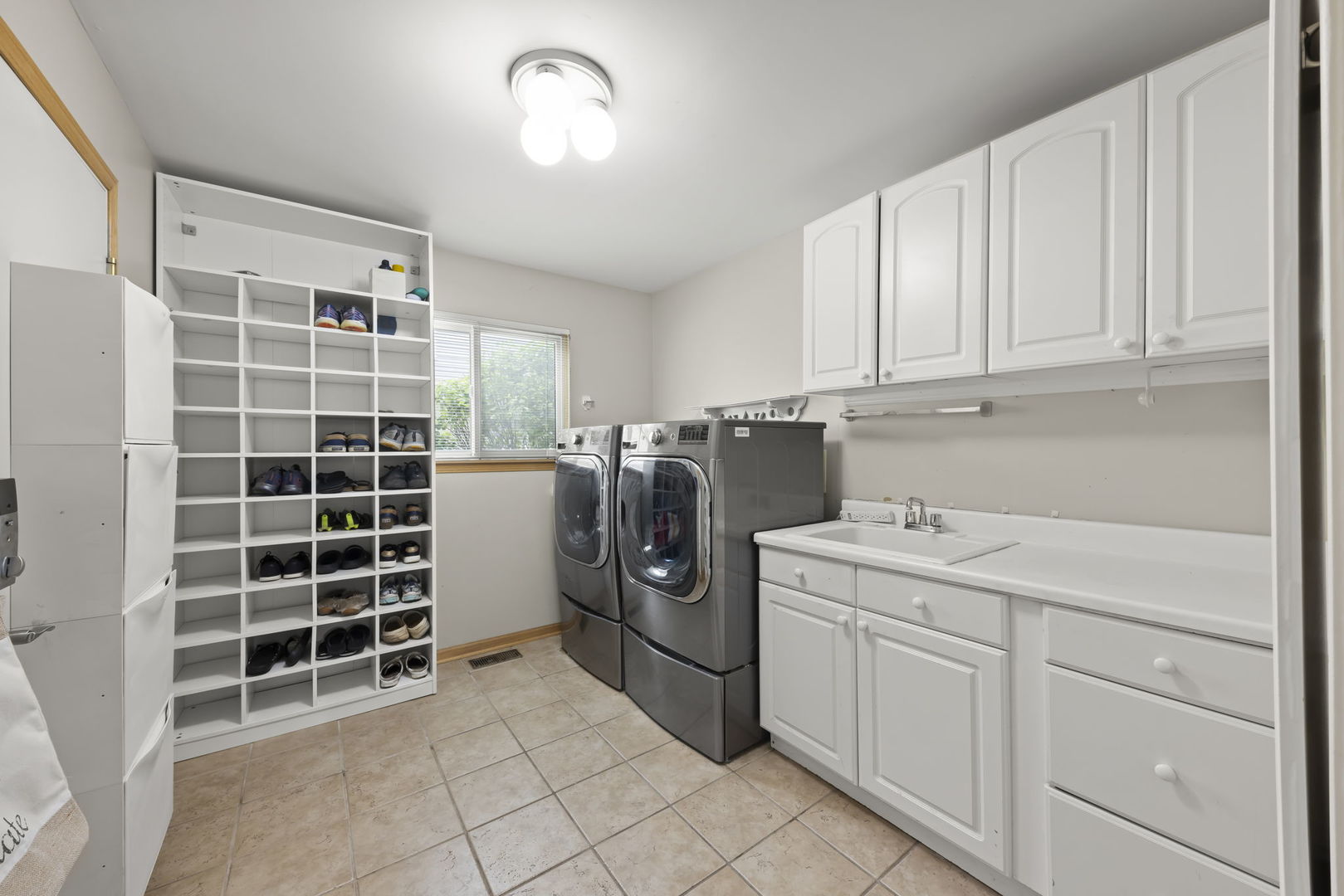 1462 Haversham Drive Aurora, IL 60502 - Photo 14 of 44 a view of a kitchen with refrigerator and cabinets