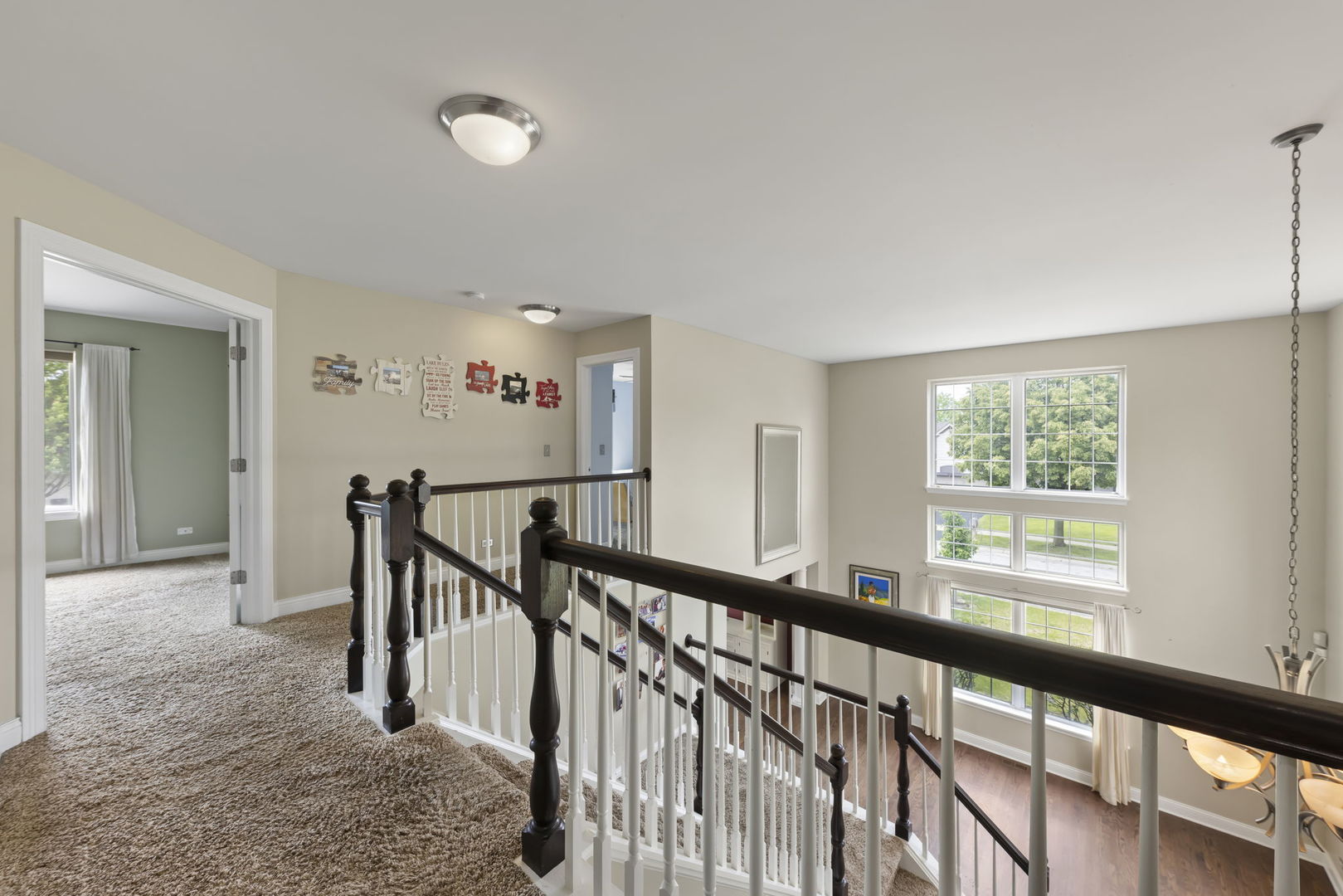 1462 Haversham Drive Aurora, IL 60502 - Photo 15 of 44 a view of a hallway with windows