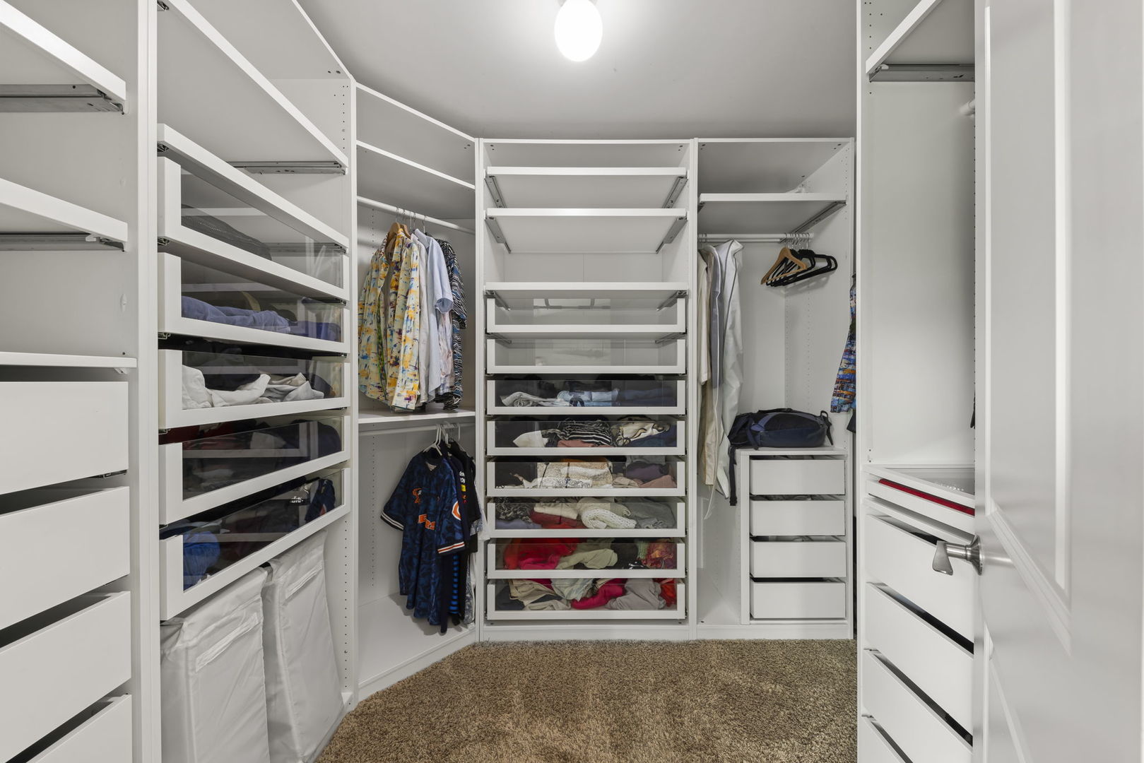 1462 Haversham Drive Aurora, IL 60502 - Photo 18 of 44 a view of walk in closet with clothes and shoes