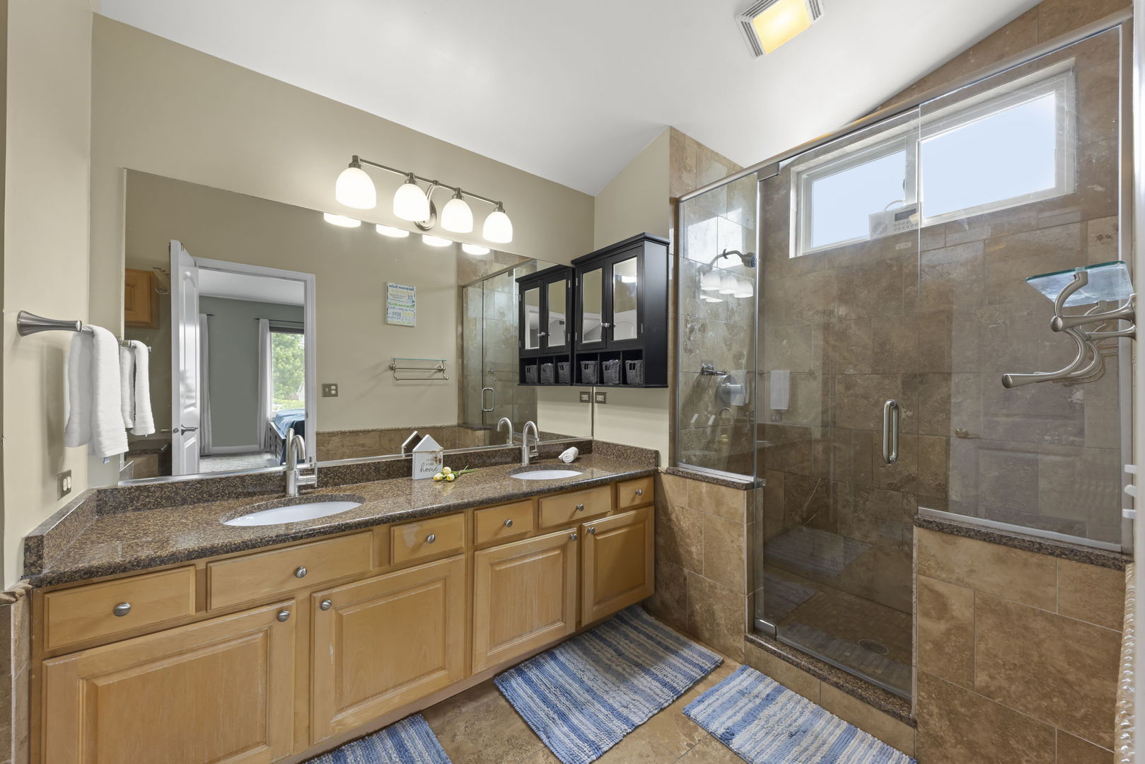 1462 Haversham Drive Aurora, IL 60502 - Photo 19 of 44 a spacious bathroom with double vanity and a shower