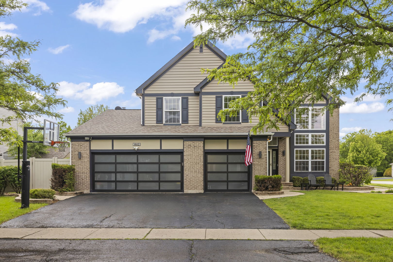 1462 Haversham Drive Aurora, IL 60502 - Photo 2 of 44 a front view of a house with a yard and garage