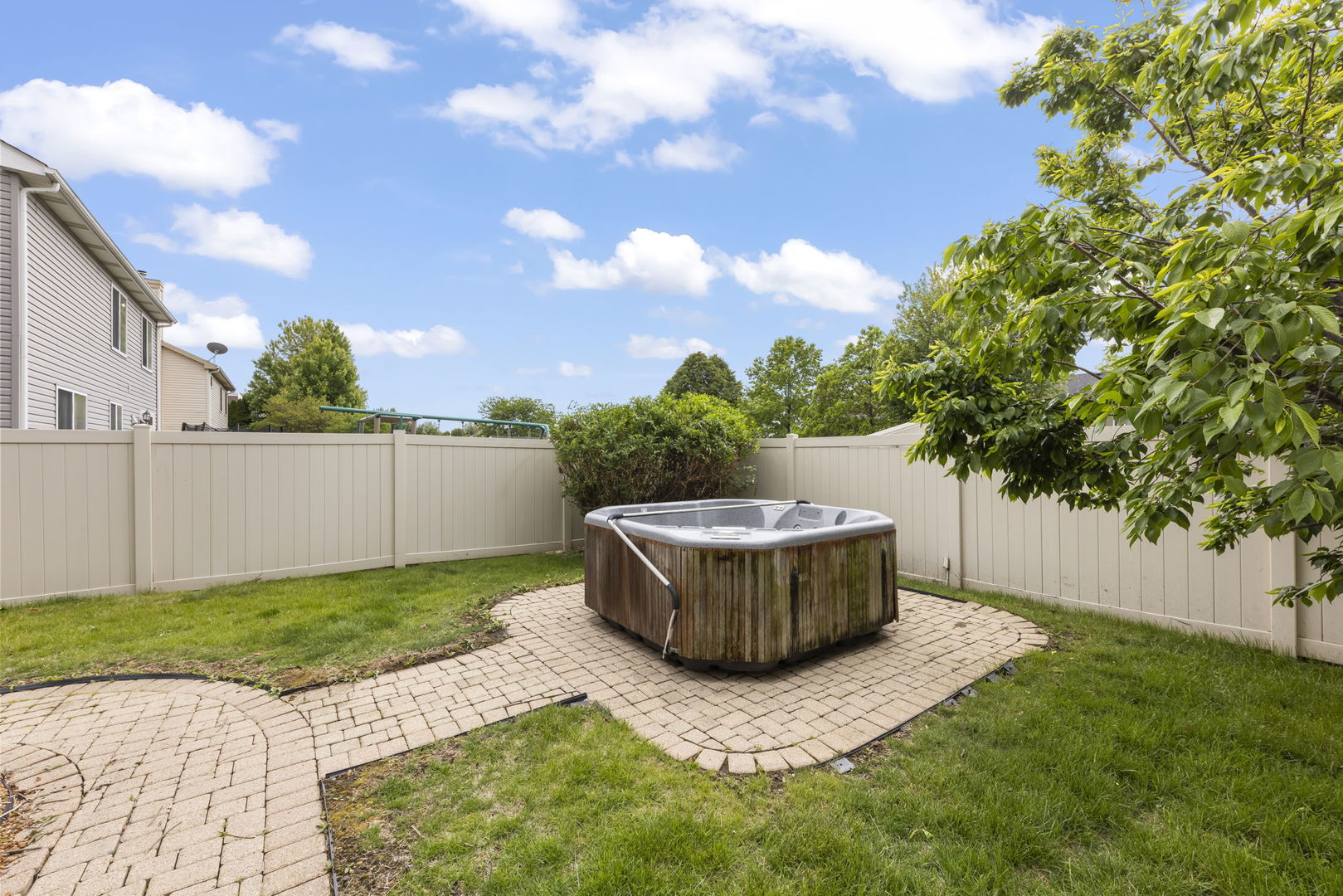 1462 Haversham Drive Aurora, IL 60502 - Photo 31 of 44 a view of a garden with a fountain