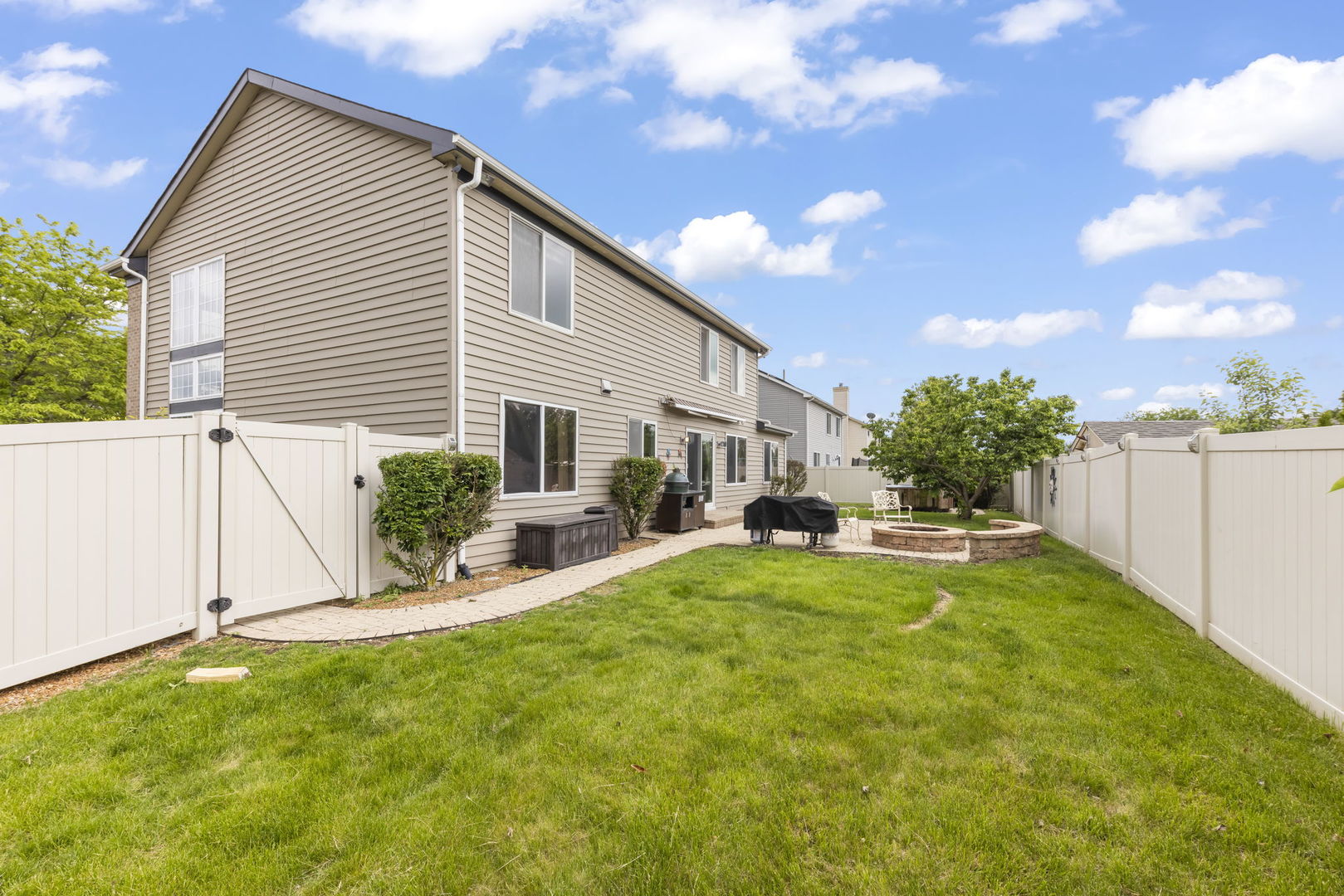 1462 Haversham Drive Aurora, IL 60502 - Photo 32 of 44 a view of a house with backyard porch and sitting area